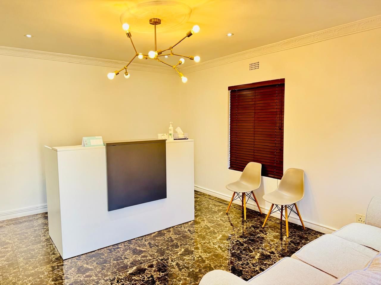 The reception desk and waiting area inside the practice